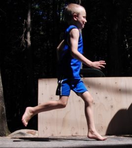 Boy demonstrating barefoot running.