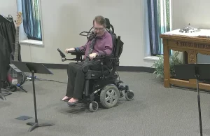 Barefoot preacher praying